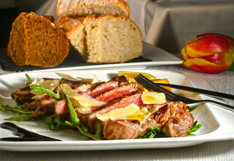 Beef tagliata with arugula and Parmesan
