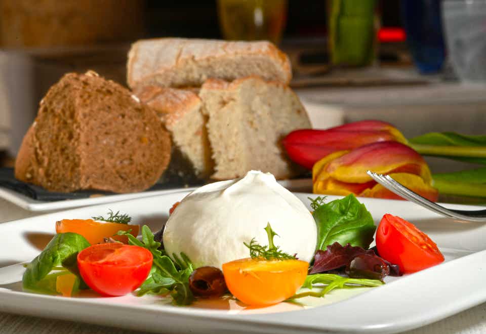 Burrata with cherry tomatoes and arugula