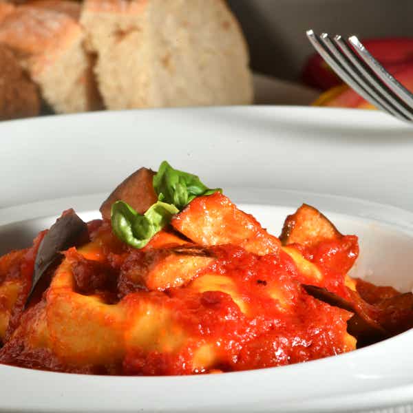 Ravioloni «alla Norma» with zucchini and scamorza cheese