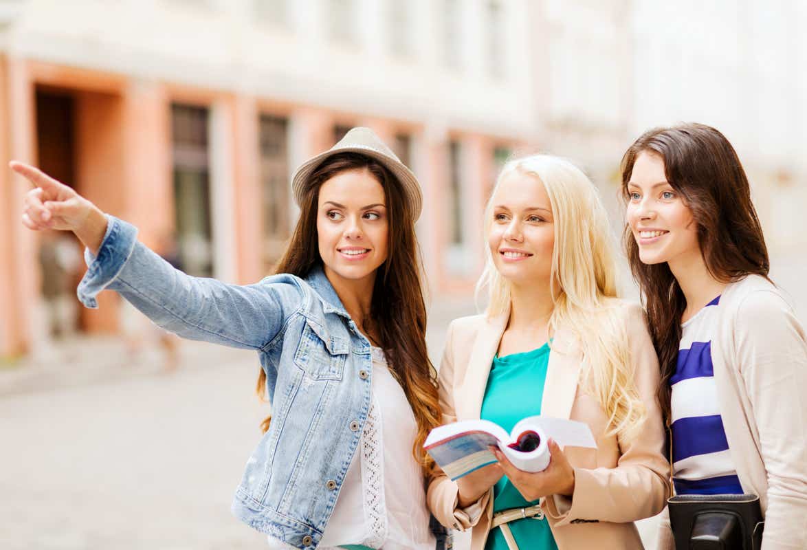 Tour group looking around in a city (Stock Photo)