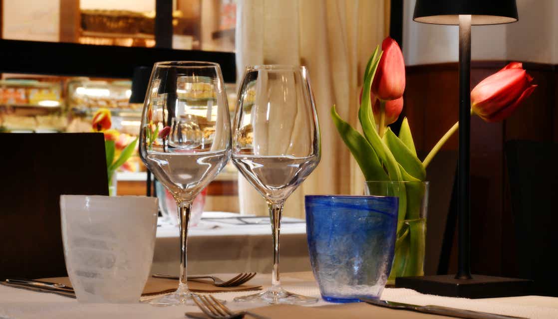 Detail of one of our tables overlooking a large window with a view of Calle del Mondo Novo in Venice